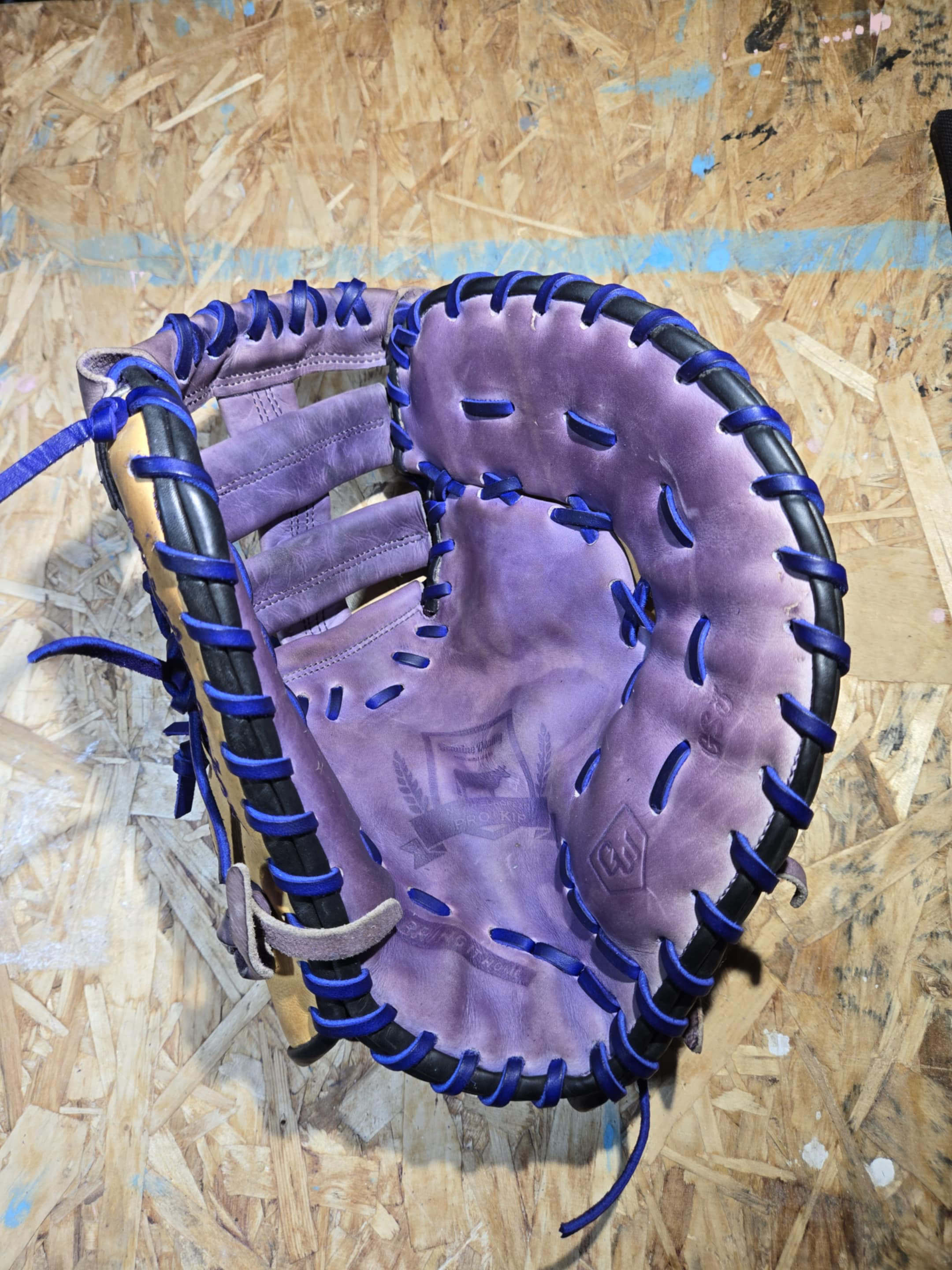 Professional glove relacing service showing expert craftsmanship